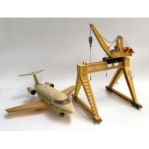 216 - A Playmobil passenger jet, together with a freight crane