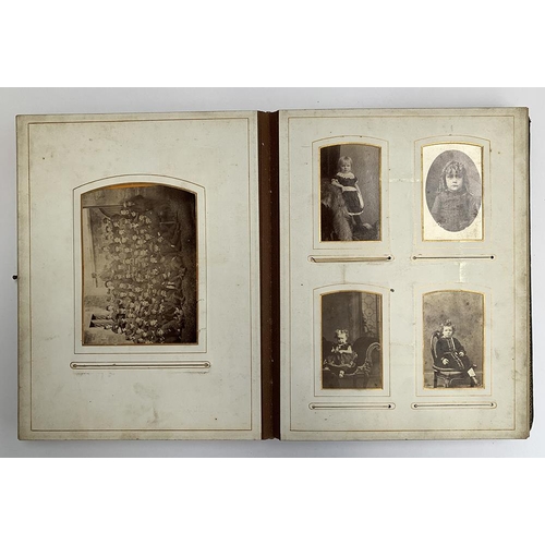 229 - A late Victorian photograph album, containing approx. 110 photos