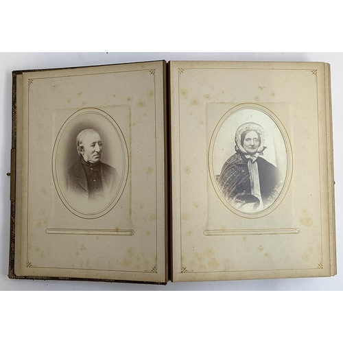 230 - A Victorian photo album containing a quantity of black and white photos, approx. 60 photos