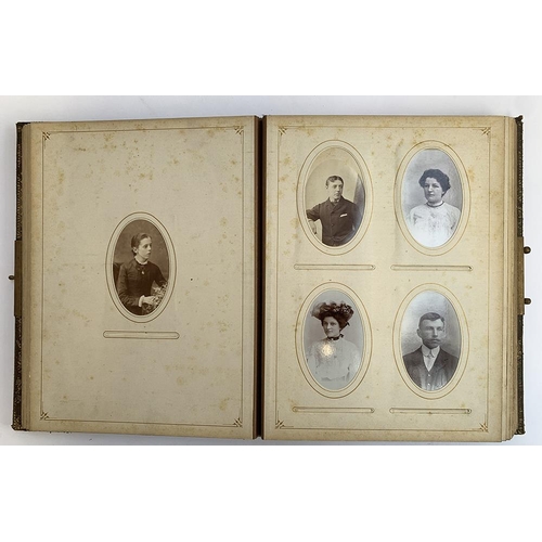 230 - A Victorian photo album containing a quantity of black and white photos, approx. 60 photos