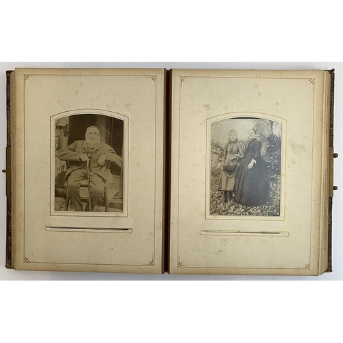 230 - A Victorian photo album containing a quantity of black and white photos, approx. 60 photos