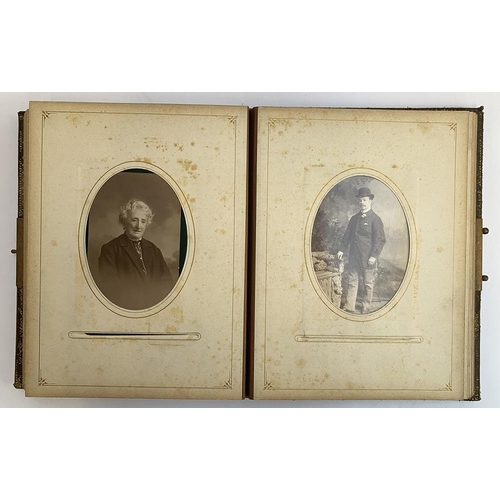 230 - A Victorian photo album containing a quantity of black and white photos, approx. 60 photos