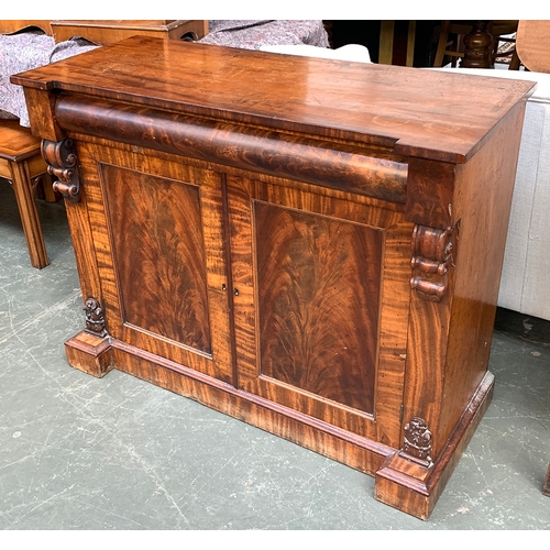 534 - A Victorian mahogany sideboard, with cushion drawer over cupboard doors, on plinth base