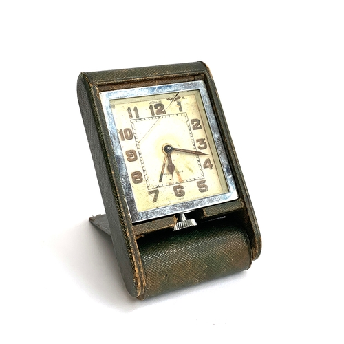 146 - A Le Coultre eight day folding leather travelling clock (af)