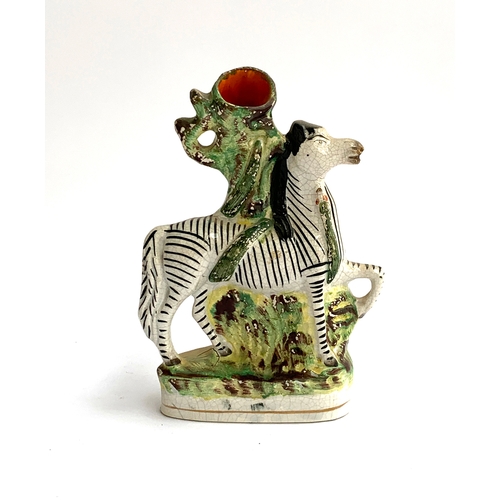 73 - A Staffordshire flatback spill vase in the form of a zebra, 20cmH