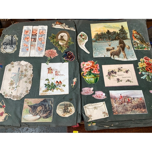 250 - A late 19th/early 20th century scrapbook; together with a postcard album with a number of black and ... 