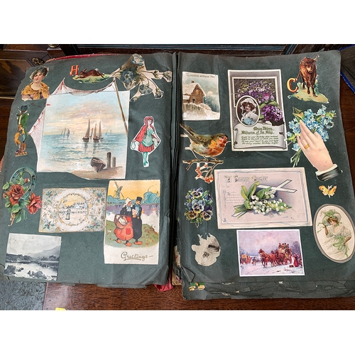 250 - A late 19th/early 20th century scrapbook; together with a postcard album with a number of black and ... 