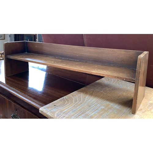 540 - A brown painted pot cupboard, together with an oak desktop book rack