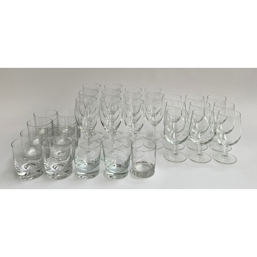 57 - A mixed lot of glassware to include various stemmed wine glasses, whiskey tumblers, and a quantity o... 