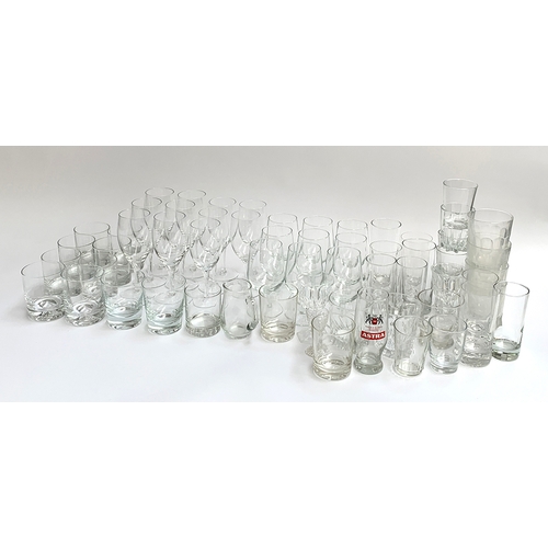 57 - A mixed lot of glassware to include various stemmed wine glasses, whiskey tumblers, and a quantity o... 