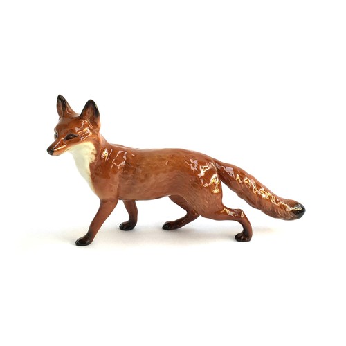 86 - A Beswick figurine of a fox, approx. 23cmL