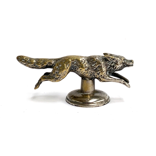 97 - A brass car mascot in the form of a running fox, 12cm long