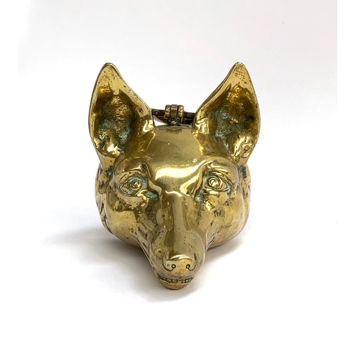 102 - A 19th century brass fox mask door stop, 16cm high