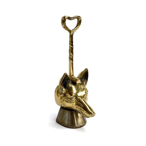 103 - A 19th century brass and iron fox mask doorstop, with twist design handles on horse hoof bases, 36cm... 