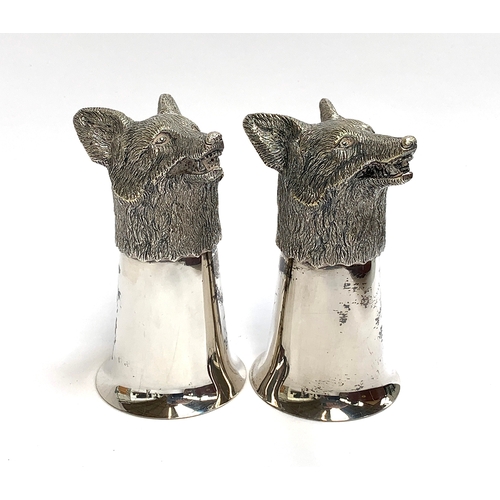 84 - A pair of plated fox mask stirrup cups, silver gilt interior, each 12.5cm high