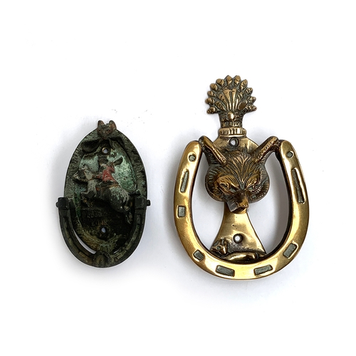 107 - A brass fox mask and horseshoe door knocker, 14.5cm; together with another hunting knocker with hunt... 