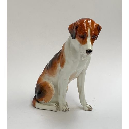 112 - A Royal Worcester figure of a seated foxhound, 17cm high