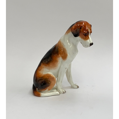 112 - A Royal Worcester figure of a seated foxhound, 17cm high