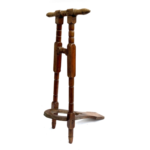 113 - An early 20th century boot pull, 83cm high