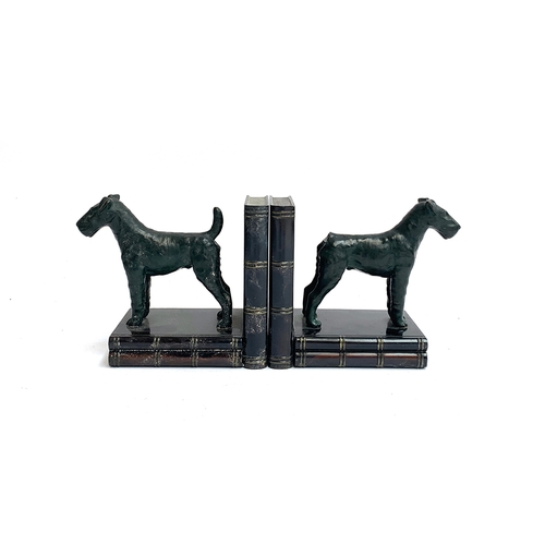 121 - A pair of bronze and cast metal book ends, in the form of standing fox terriers, 13cm high, one with... 