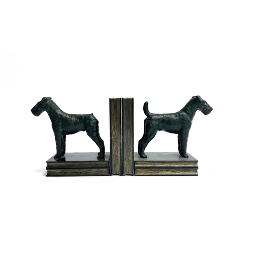 121 - A pair of bronze and cast metal book ends, in the form of standing fox terriers, 13cm high, one with... 