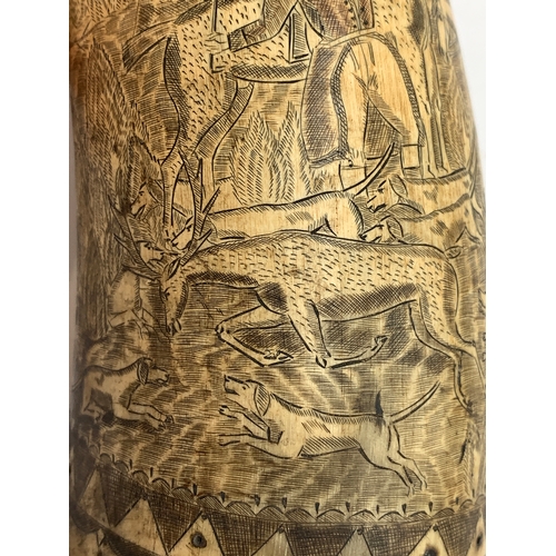 303 - A 19th century carved cow horn, inscribed 'The British Sportsman, The Leather', depicting huntsman a... 