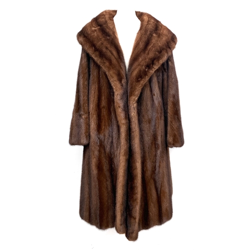 887 - A mink fur coat retailed by Calman Links, London, with shawl collar