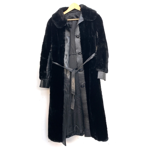 900 - A black leather and fur coat, approx. size 8-10