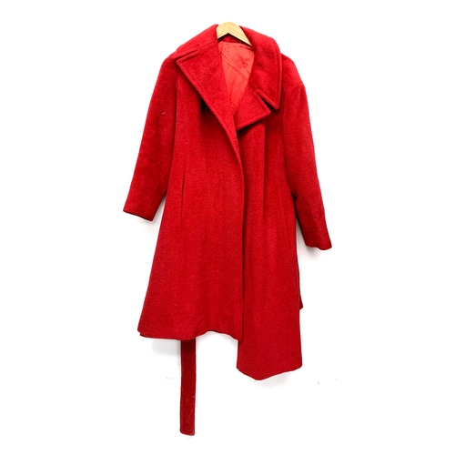 908 - A ladies red overcoat, approx. size 14; together with a further tweed overcoat with velvet collar, e... 