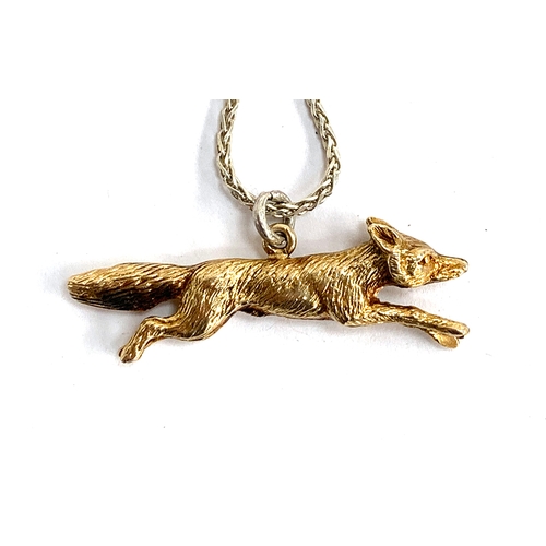 76 - An Asprey 9ct gold running fox, on a .925 silver chain, marked London 1967, approx. 6.9g