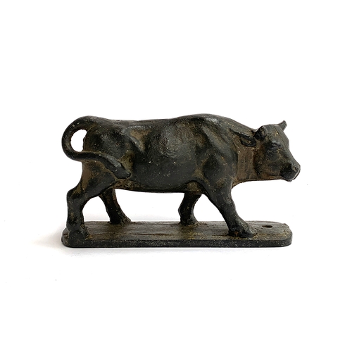 99 - A Victorian cast iron car mascot modelled as a bull, approx. 16cm long