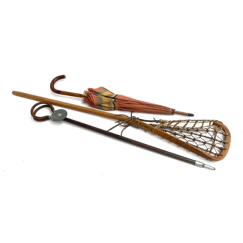 205 - A vintage lacrosse stick, shooting stick, and umbrella (3)