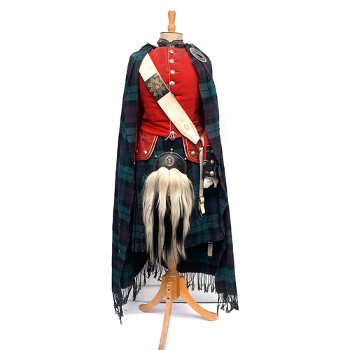 601 - A British dress uniform of the 105 Glasgow Highlanders, including scarlet red tunic, woollen tartan ...