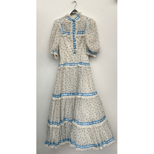 912 - A late 20th century coming out dress, made by Regamus, with a silk tie