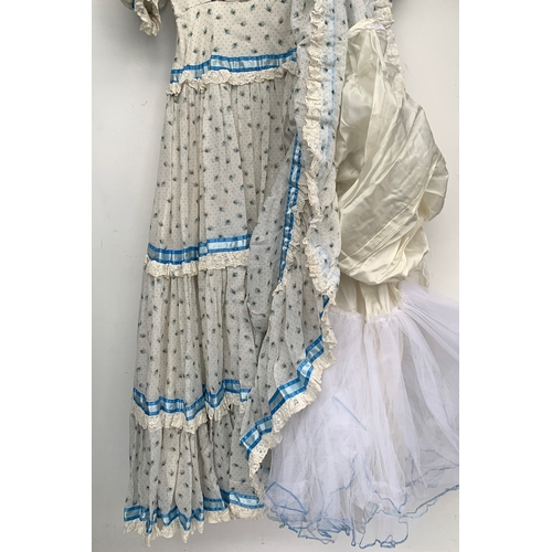 912 - A late 20th century coming out dress, made by Regamus, with a silk tie