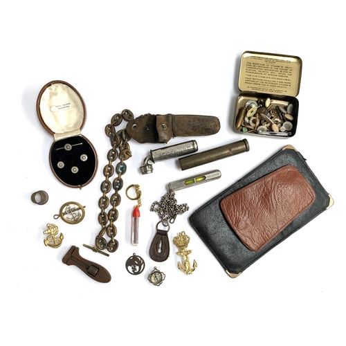 44 - A mixed lot of interesting things to include trench art fob chain; a collection of buttons; brass co... 