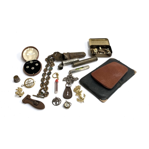 44 - A mixed lot of interesting things to include trench art fob chain; a collection of buttons; brass co... 