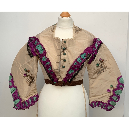 924 - A Victorian silk jacket, with lace and purple trim