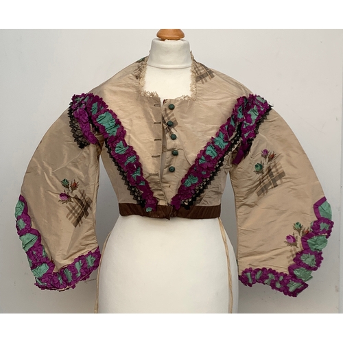 924 - A Victorian silk jacket, with lace and purple trim