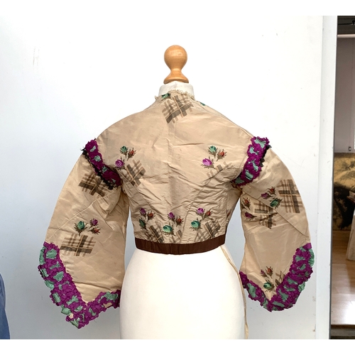 924 - A Victorian silk jacket, with lace and purple trim