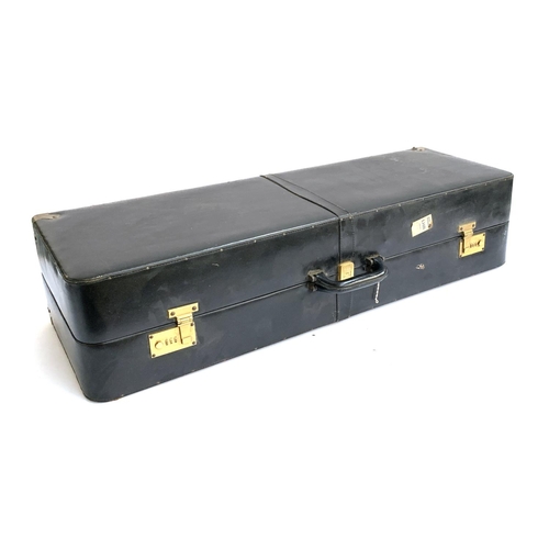 1048 - A black leather shoe travel case, with brass fittings, the interior with eight compartments, with a ... 