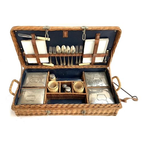 1049 - A vintage wicker picnic hamper, with fitted interior with contents, including four ceramic lined tin... 