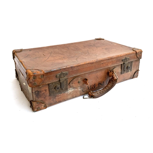 1066 - A vintage leather suitcase, marked Carlisle, 67x40x19cm; together with one other, vintage canvas and... 