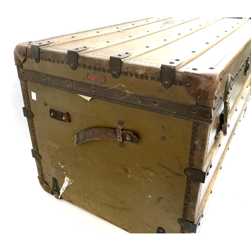 1067 - A large canvas and wood banded travel trunk by Ernst Ott, Wien V Castelig, handles af, leather corne... 