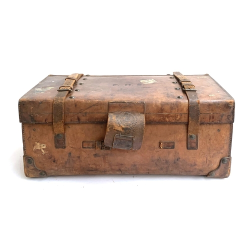 1070 - A Victorian leather and brass studded trunk by W. Insall & Sons, Bristol, with leather straps and ca... 