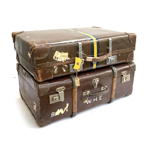 1072 - A vintage revelation suitcase with leather corners, the top marked W.H.E, with key; together with on... 