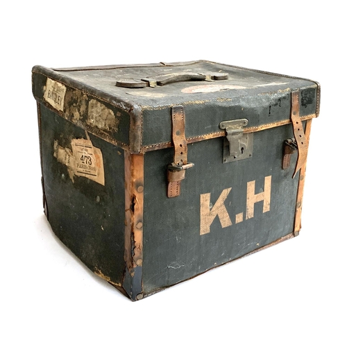 1075 - An early 20th century canvas and leather suitcase, with travel stickers, 46x36x41cm