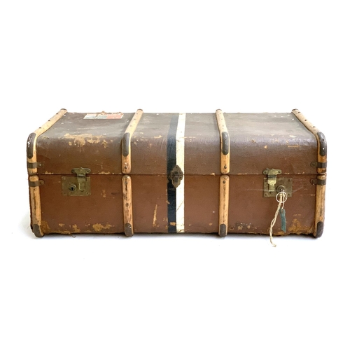 1077 - A canvas and wood banded travel trunk with travel stickers and key, Warranted 3 ply, removable tray