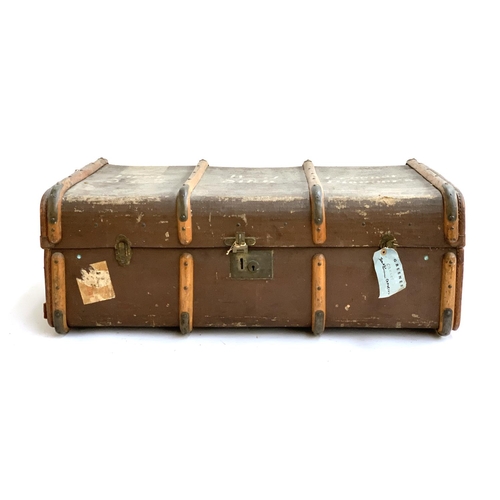 1079 - An Army and Navy woodbanded canvas travel trunk, marked Lt. W. J. Greener, 34th Sikh Pioneers