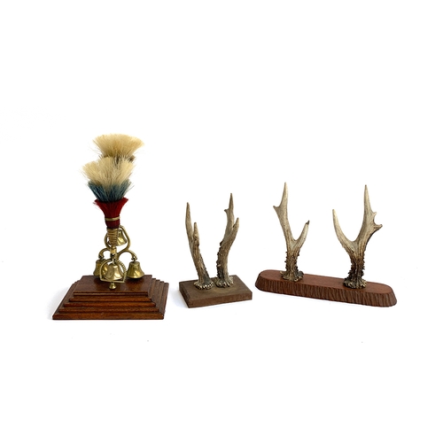 237 - Two pairs of roe deer antlers mounted on wooden plaques; together with a regimental set of brass bel... 
